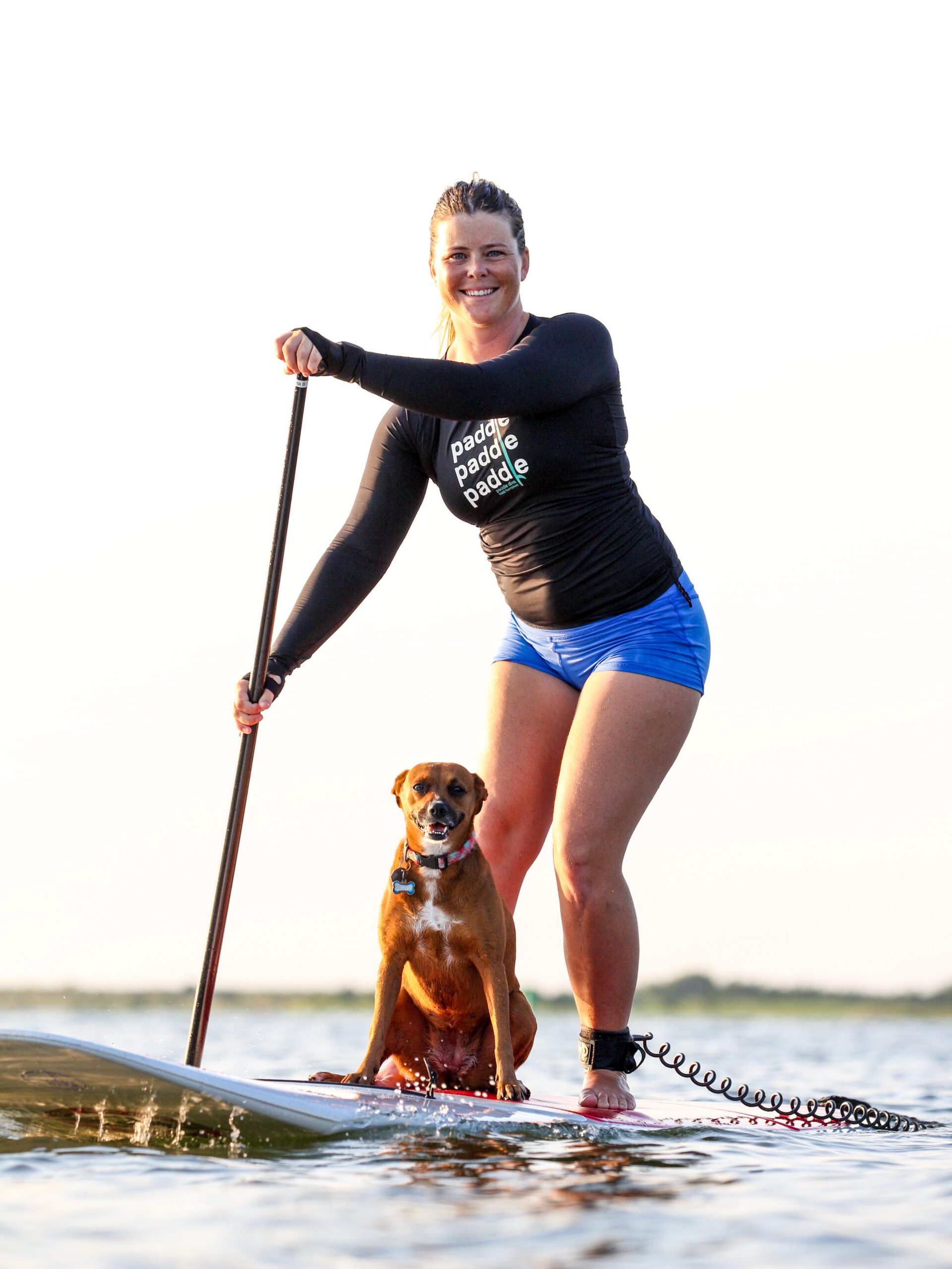 a woman holding a dog