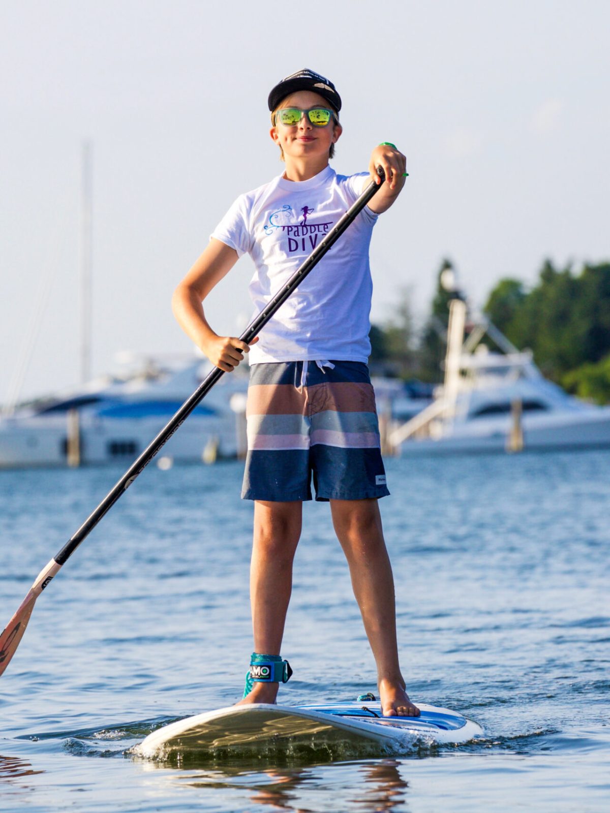 a person standing on a paddle board in the water