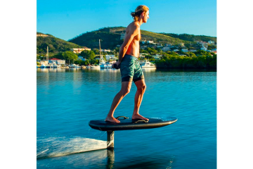 a person riding a skate board on a body of water